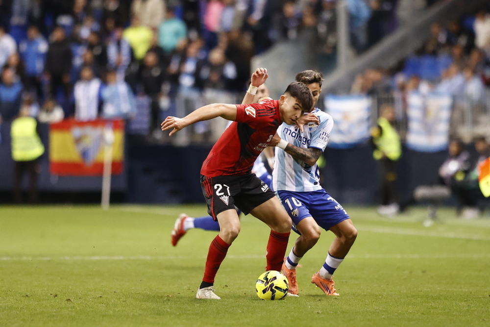 Larrubia y Tamarit disputando un balón / Foto: Diario de Burgos